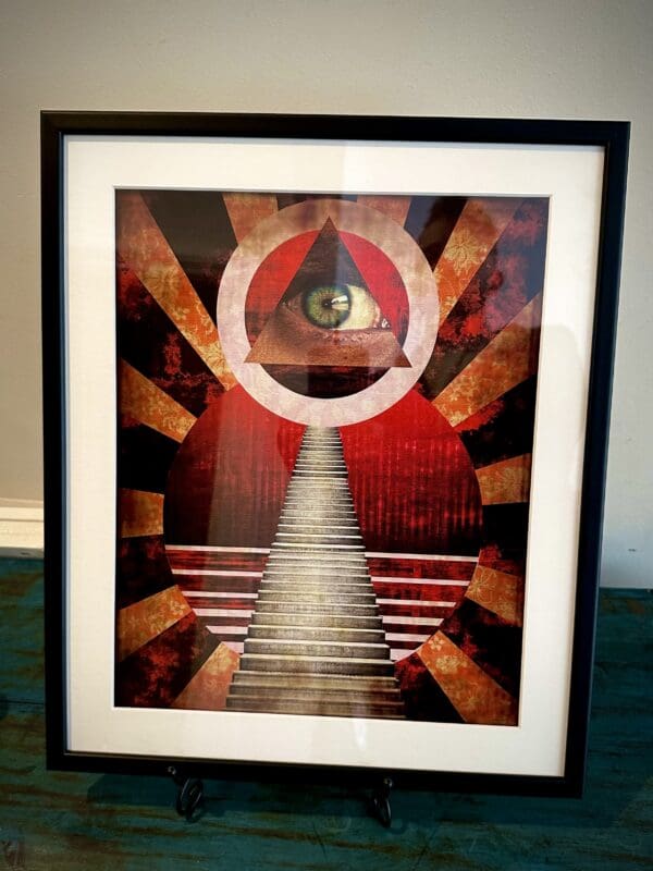 A framed picture of an eye and stairs